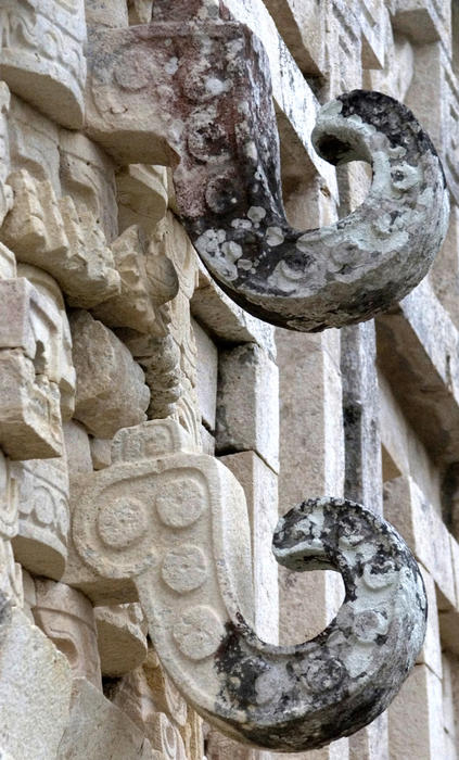 one of the many stone carvings on the myan temple at Uxmal, mexico